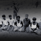 Reuters reported, “This photo was taken on the day the 10 Rohingya men were killed. Paramilitary police officer Aung Min, left, stands guard behind them. The picture was obtained from a Buddhist village elder, and authenticated by witnesses.”